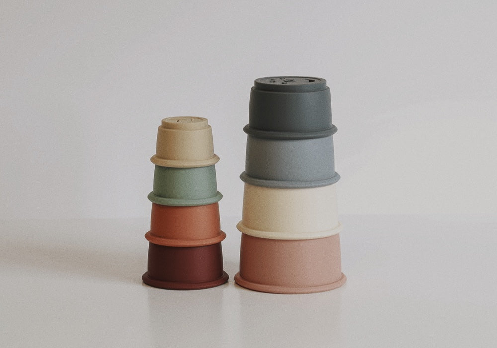 Vibrant silicone stacking cups in assorted sizes and colors.