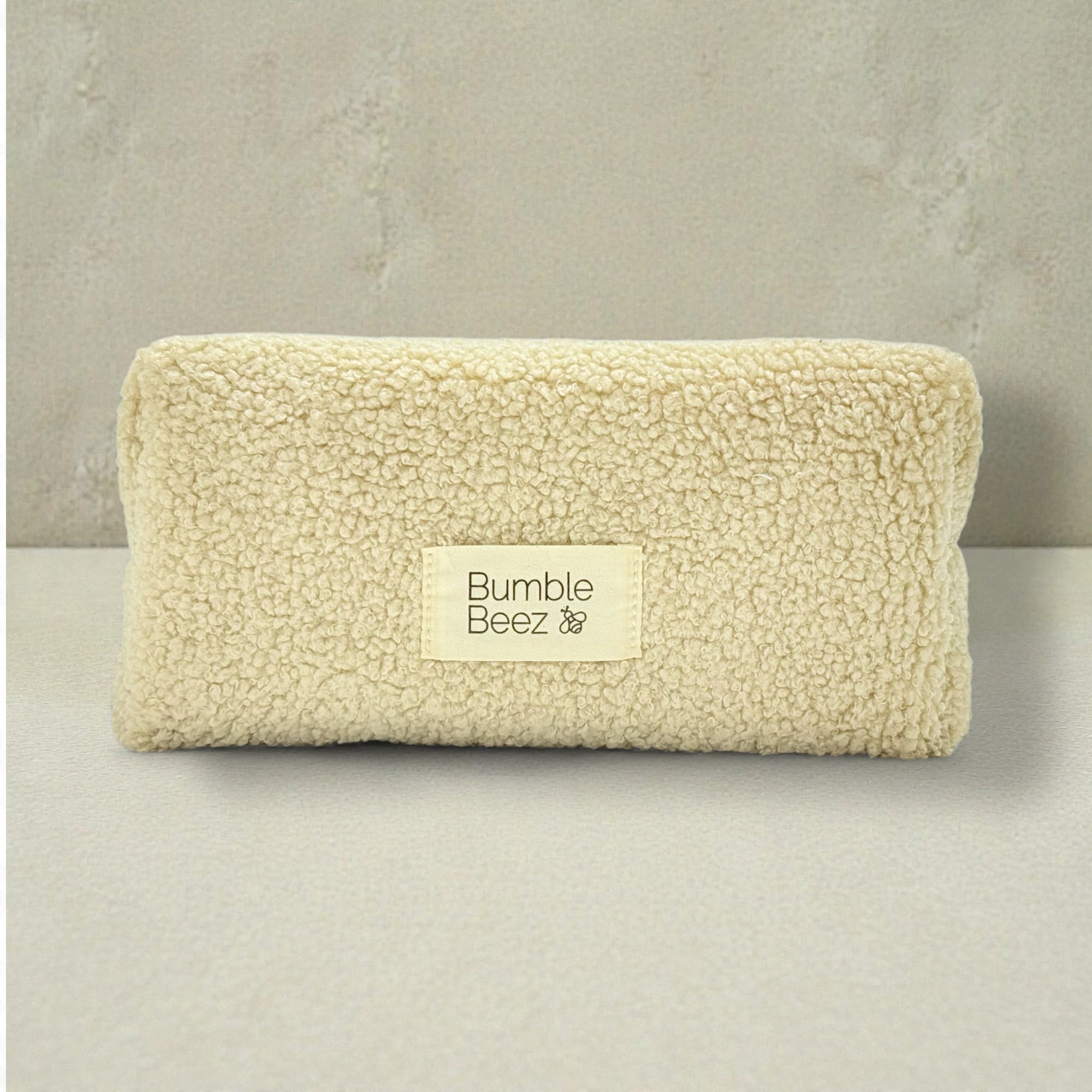 The Boucle Bathroom Bag soft cream boucle fabric toiletry pouch with zip closure