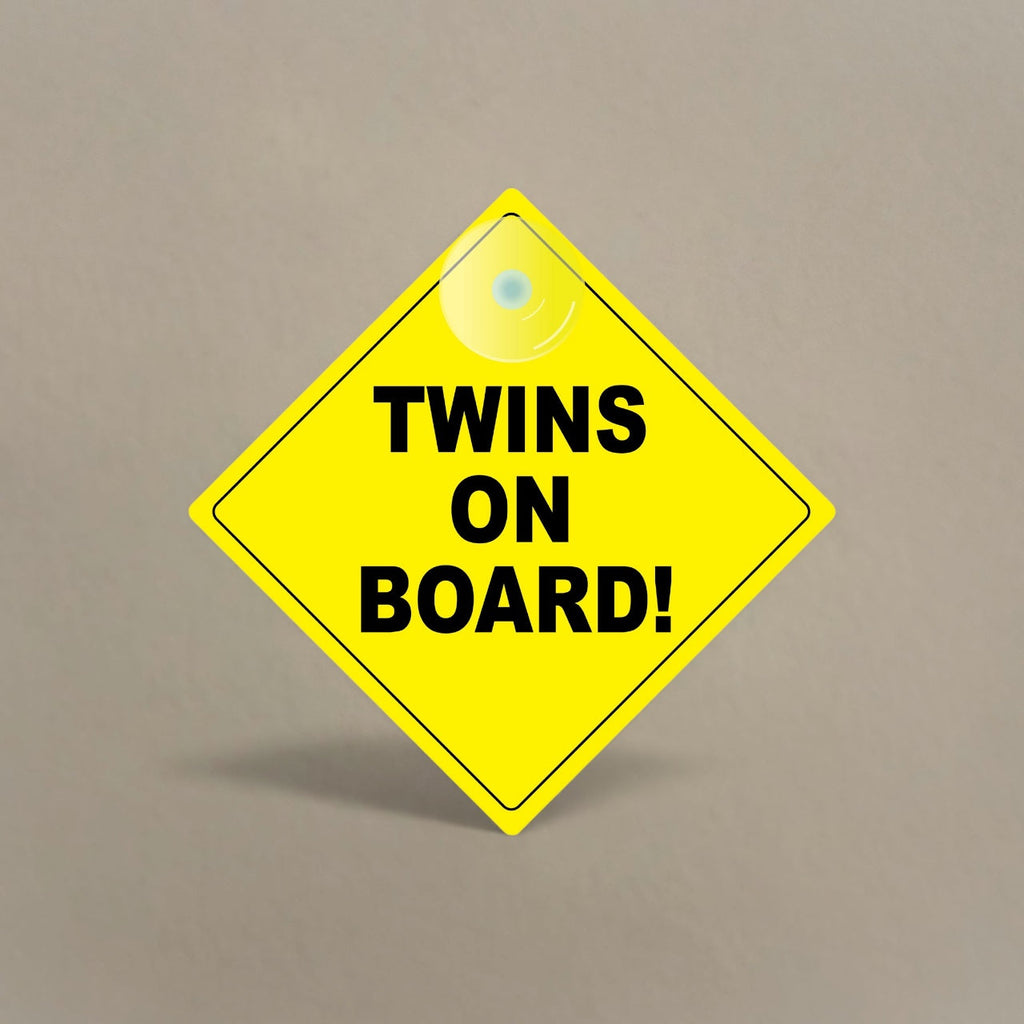 Bright yellow Twins On Board car sign with suction cup for window attachment and black lettering for visibility