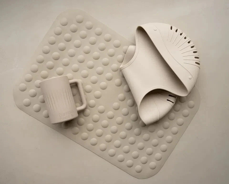 The Bubble Bath Mat soft beige silicone anti-slip bath mat with suction cups for safety and comfort