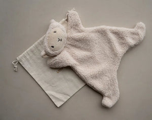 Little Snuggler baby comforter in soft faux lamb wool with embroidered lamb face and cuddly texture on beige background