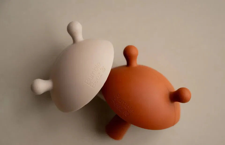 The Mushroom Teething Wand soft silicone baby teethers in cinnamon and biscuit colors for infants