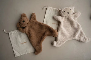 The Little Snuggler plush baby comforters in bear and lamb styles made of soft faux lamb wool