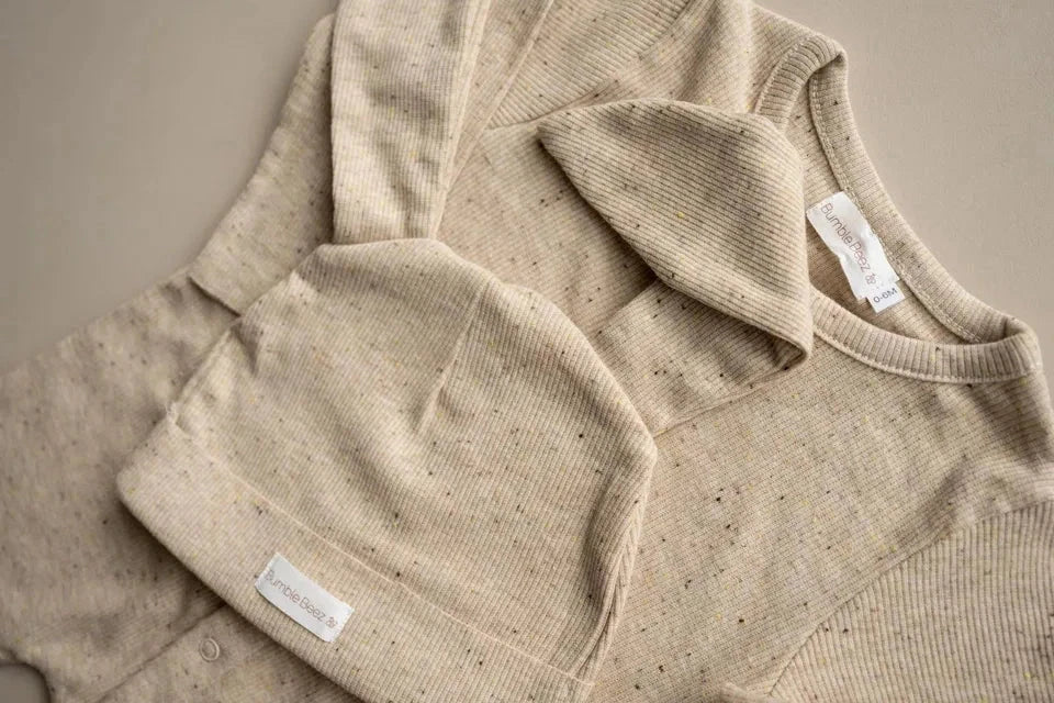 The Bunny Sprinkle Set oatmeal baby romper and hat with floppy ears in ribbed cotton blend