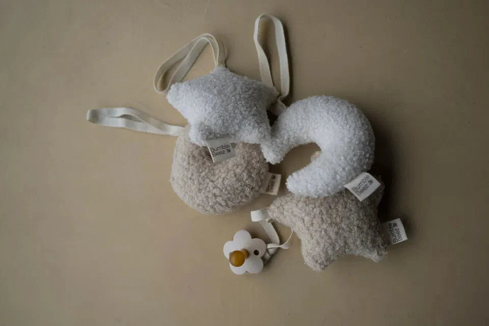 Sensory Moon And Stars boucle fabric baby pacifier clip and nursery decor in Milk and Biscuit tones